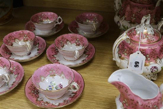 A Victorian nine piece porcelain teaset, painted with tulips